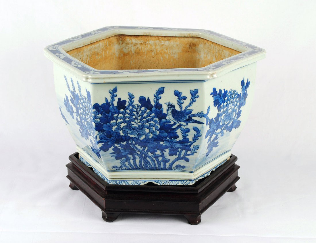 BLUE AND WHITE PORCELAIN JARDINIERE: Chinese. 19th Century. Of hexagon form, painted with chrysanthemums. Diameter 12". With wood stand. (300/400)