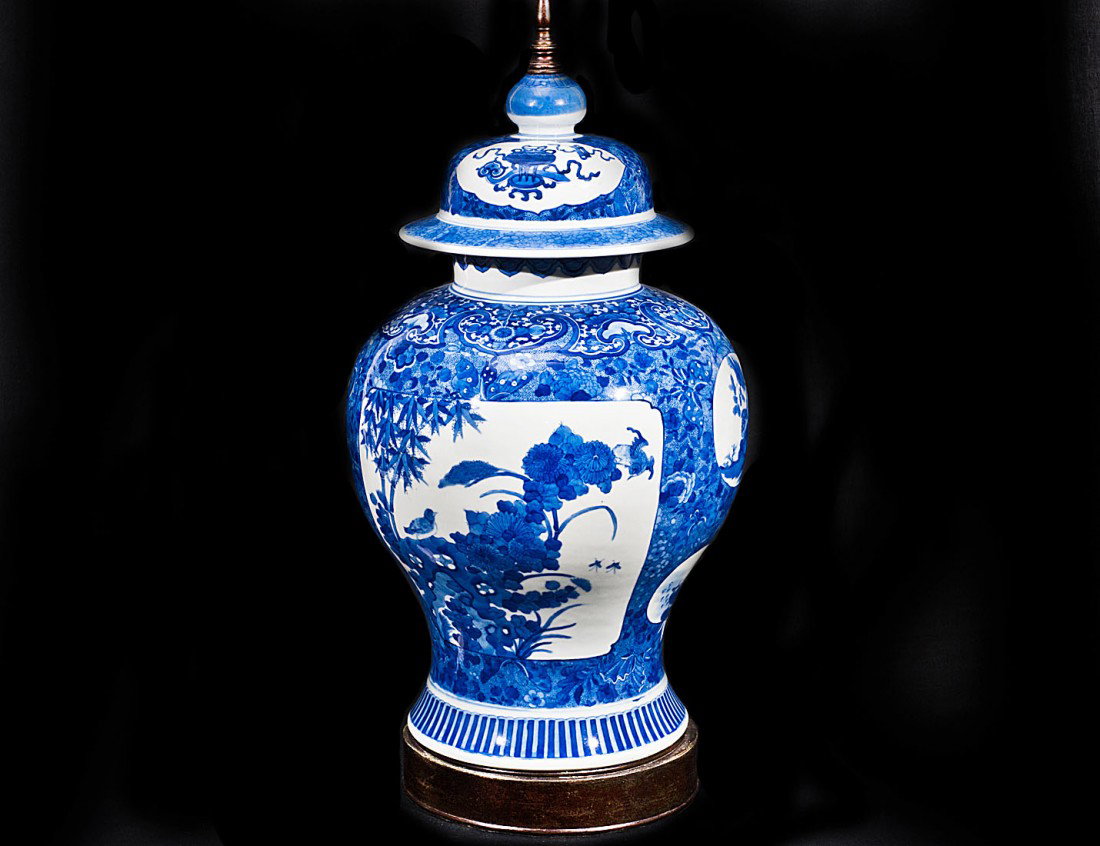 BLUE AND WHITE PORCELAIN JAR/LAMP: Oriental. Decorated with various shaped panels. Overall height 30 ½". (Cond: minor restoration to edge of lid) (100/150)