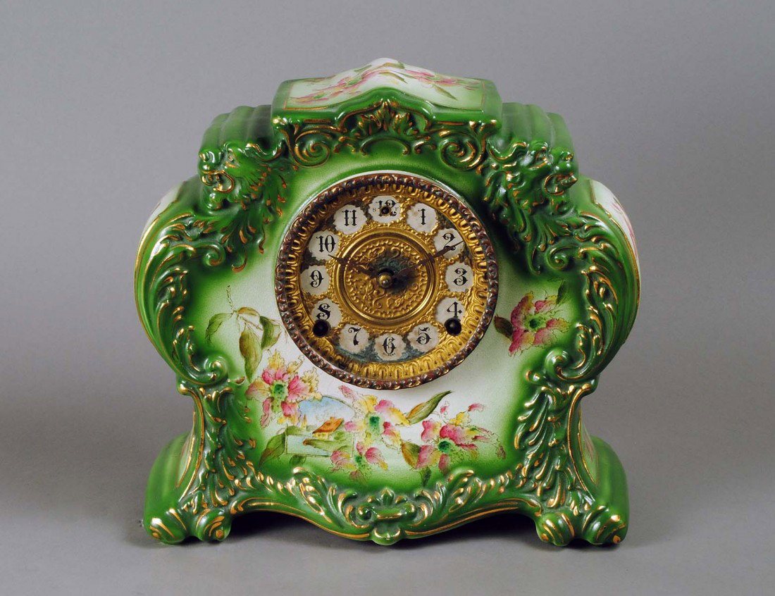 CONTINENTAL FAIENCE MANTEL CLOCK: Austrian. Circa 1920. With American movement by Gilbert. Height 11". (Cond: no back cover, age crack) (100/150)