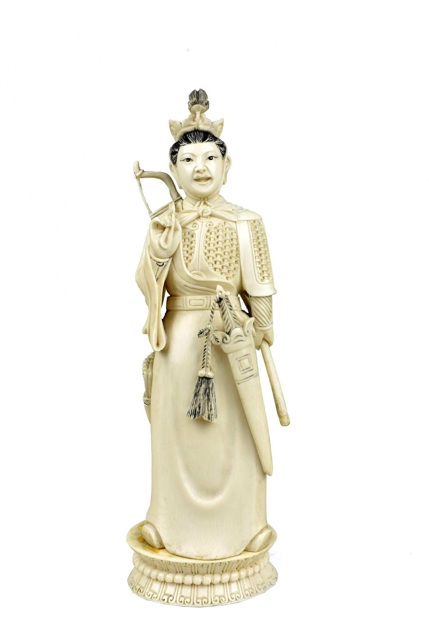 CHINESE REPUBLIC FIGURE OF A GUARDIAN , The underside with multiple incised characters. Partly clad: CHINESE REPUBLIC FIGURE OF A GUARDIAN The underside with multiple incised characters. Partly clad in amour, with sword, a bow cast upon her shoulder. height 10.25 in.