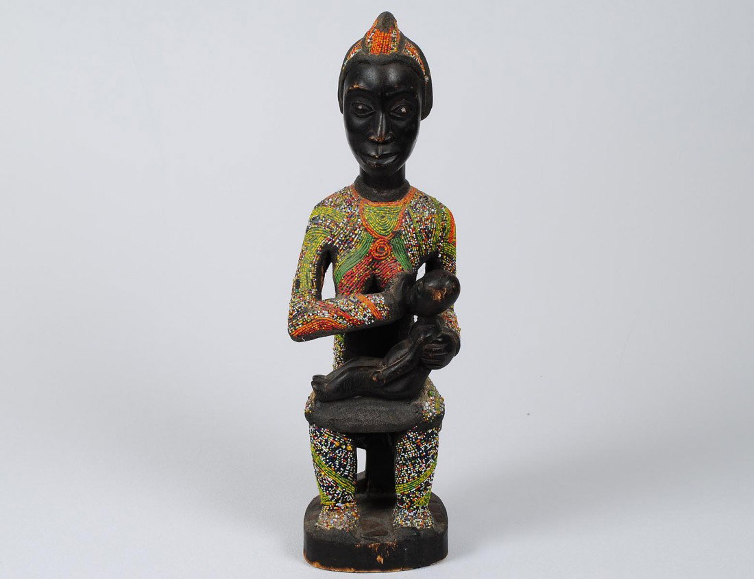 WEST AFRICAN YORUBA TRIBAL MATERNITY FIGURE: Wood with inset beads. Height 18 1/2". (Cond: good, consistent with age and wear) (150/200)