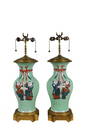 PAIR OF CHINESE FAMILLE ROSE ENAMELED VASES, MTD AS LAMPS 19th Century, with later Louis XVI Style