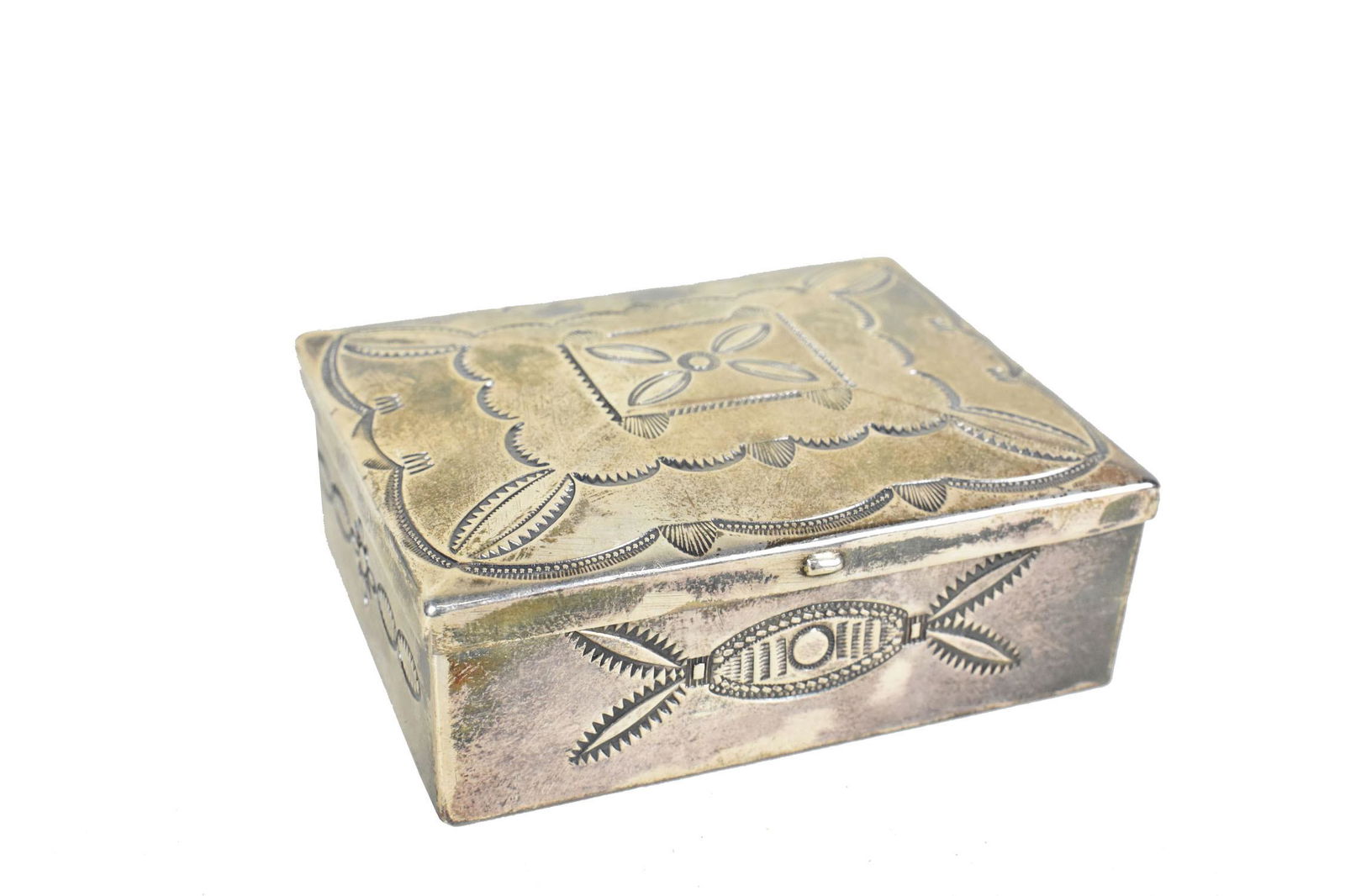 NAVAJO LIDDED SILVER BOX, Circa 1940. Unmarked. Rectangular, with a hinged lid and incised motifs. (1 of 4)