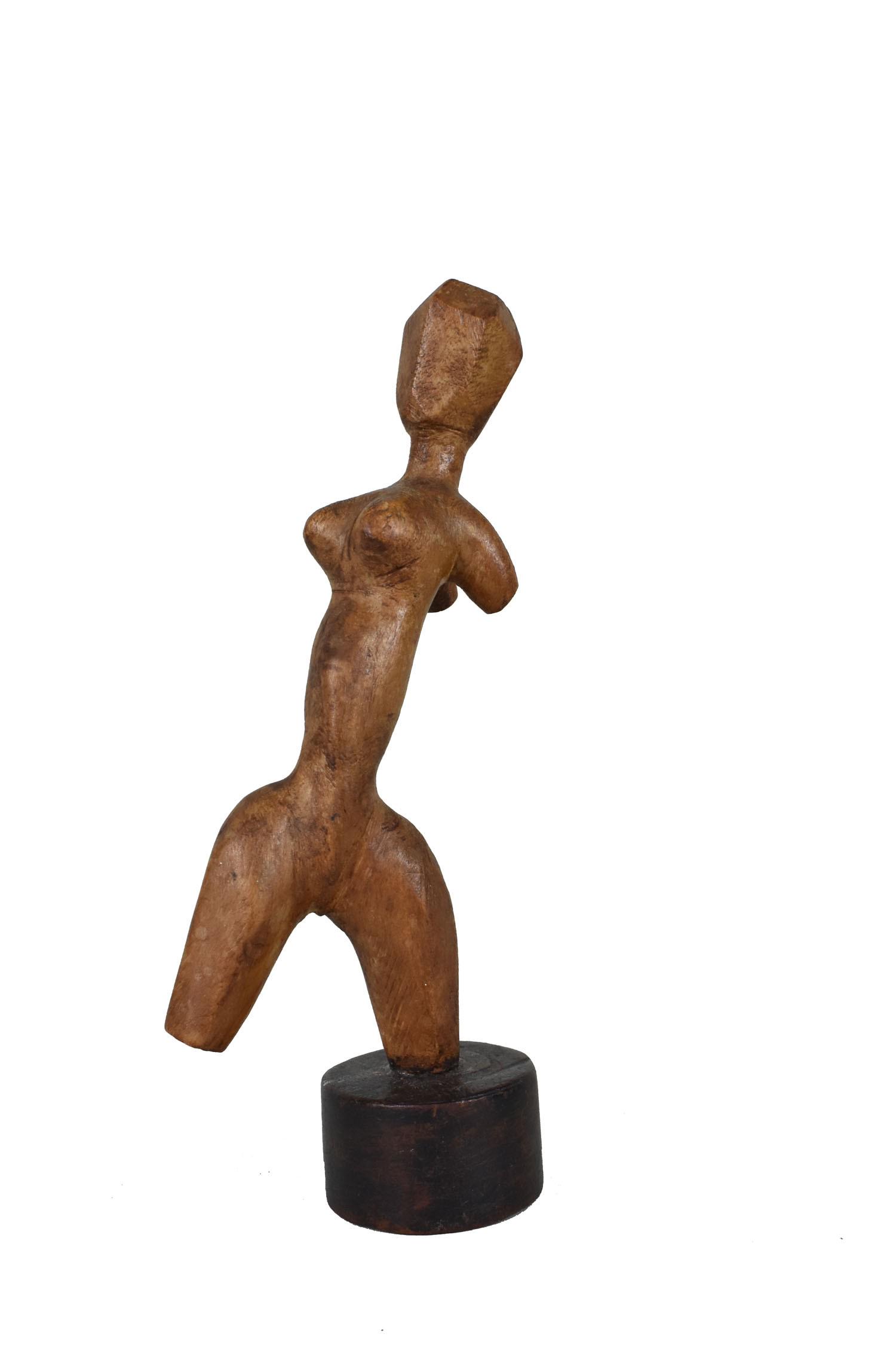 AMERICAN SCHOOL, MODERNIST WOOD FIGURE OF A WOMAN Circa 1945. On an ebonized base. Height overall 9: AMERICAN SCHOOL, MODERNIST WOOD FIGURE OF A WOMAN Circa 1945. On an ebonized base. Height overall 9 in., Width 3 in.
