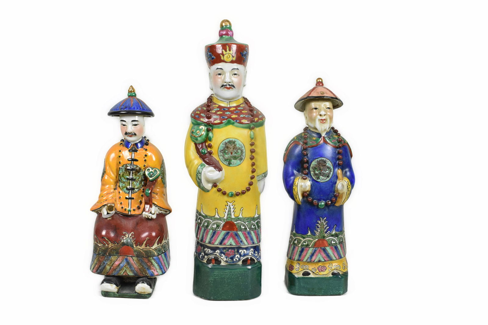 THREE CHINESE PORCELAIN FIGURES Each with an impressed seal. Depicting elaborately dressed (1 of 8)