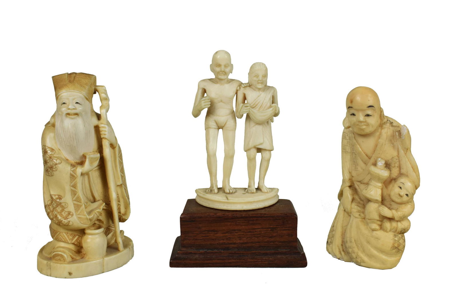 TWO JAPANESE AND AN INDIAN CARVED FIGURE The first and second depicting priests, the Indian example, (1 of 6)