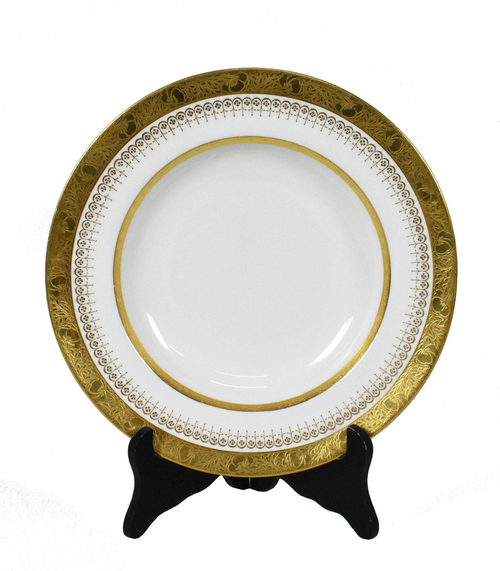 SET OF TEN MINTON PARCEL GILT PORCELAIN SOUP BOWLS, The underside of each with factory marks. Each: SET OF TEN MINTON PARCEL GILT PORCELAIN SOUP BOWLS The underside of each with factory marks. Each with multiple gilt borders. Diameter 9 in.