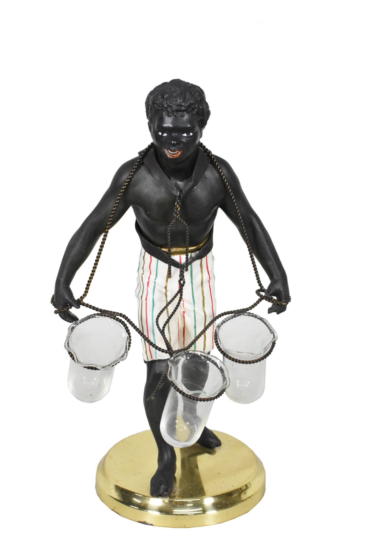 CONTINENTAL PAINTED METAL BLACKAMOOR , The standing figure in white striped leggings and holding (1 of 4)