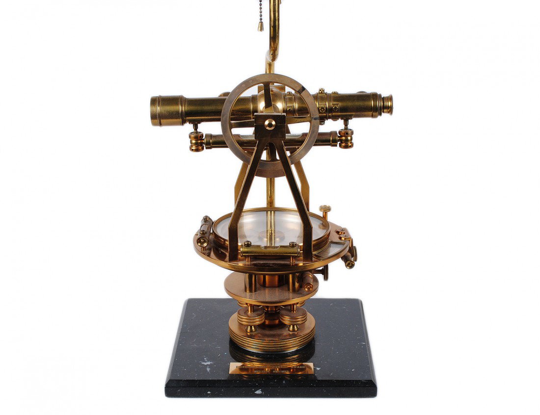 UNUSUAL BRASS TRANSIT LEVEL/LAMP: American. By W.L. & Gurley, Troy, NY. with level, compass and telescope. Overall height 30". Note: Presented by the Rensselaer Alumni Association Distinguished Service Award, 1972, to Milton Brumer, C