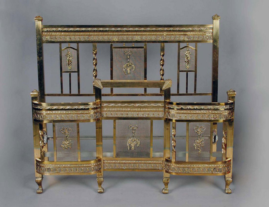 VICTORIAN STYLE BRASS HEADBOARD AND FOOTBOARD: 20th Century. With floral and figural medallions, joined by steel rails. Width 55". (600/800)