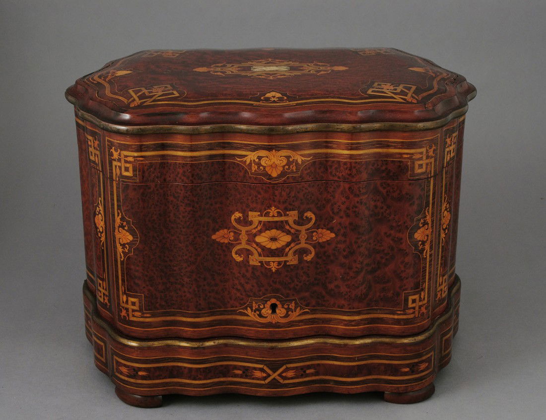 GOOD INLAID BURL LIQUEUR CASE: French. Early 20th Century. With hinged cover and sides opening to the interior containing four bottles and eleven glasses. Height 10 7/8". (700/900)