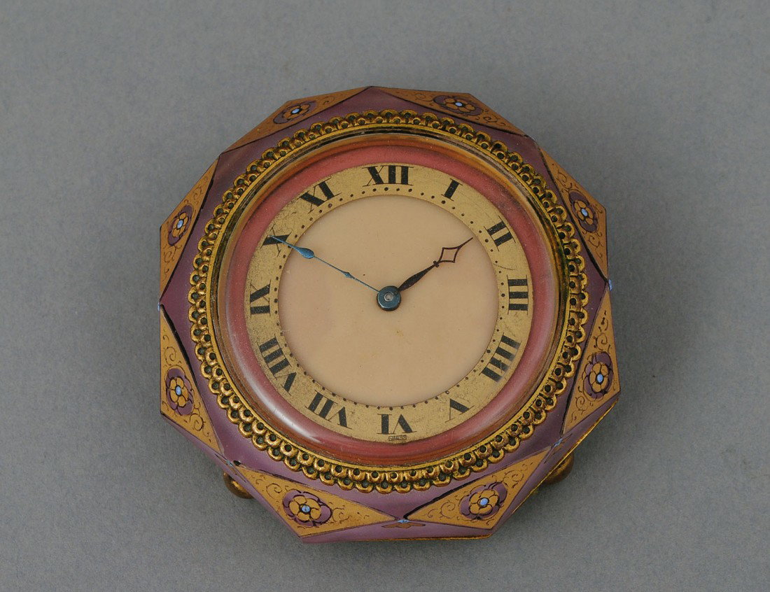 ENAMELED GLASS TABLE CLOCK: European. Circa 1920. With Swiss movement. Diameter 2 1/2". (200/300)
