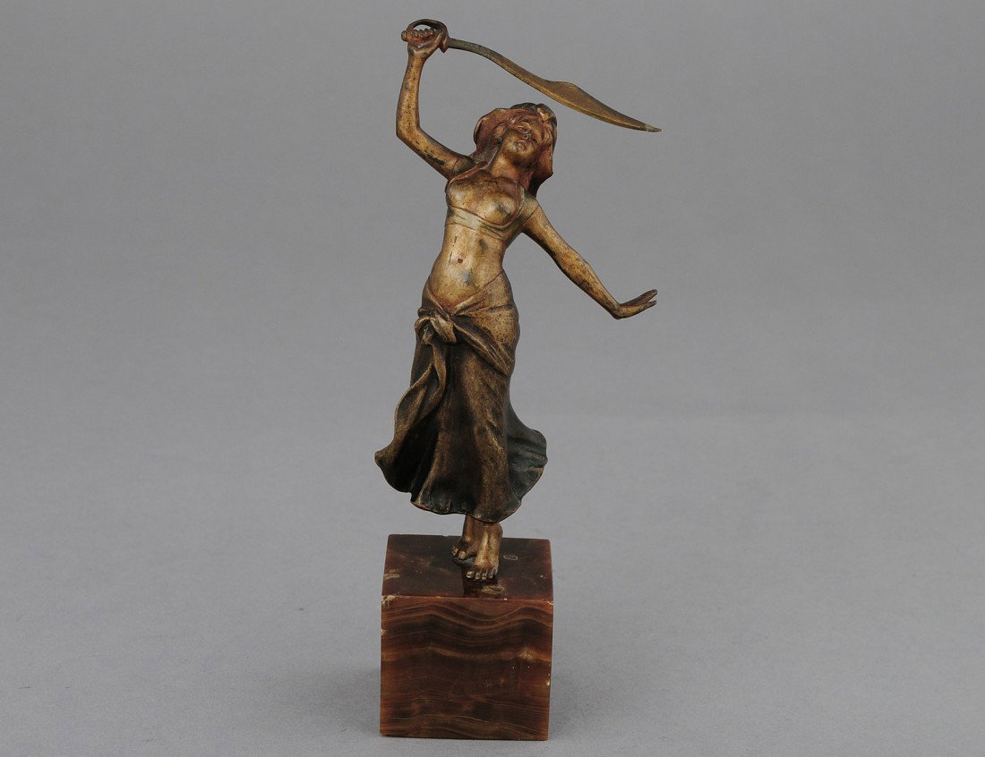 GILT BRONZE FIGURE OF A FEMALE: Signed Fritz. Dancing with a sword, mounted on an onyx base. Height 7 3/8". (100/150)