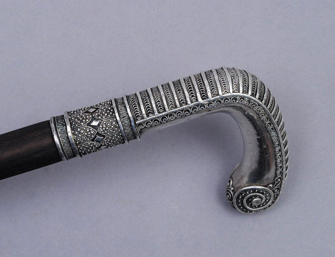 SILVER FILIGREE MOUNTED EBONY WALKING CANE: American. Late 19th Century. Length 36". (200/300)