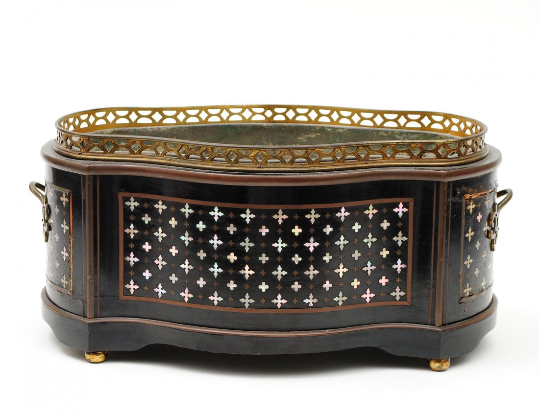 MOTHER OF PEARL AND BRASS INLAID EBONIZED WOOD TAB: French. Late 19th Century. Of shaped ovoid form, fitted with a metal liner. Length 15 3/4". (300/400)