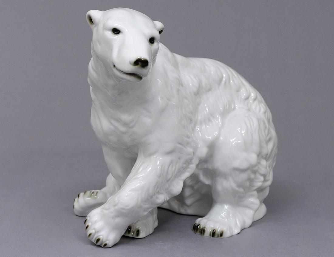ROYAL DUX PORCELAIN FIGURE OF A POLAR BEAR: Czechoslovakian. Embossed and printed mark. Length 12 1/2". (300/400)