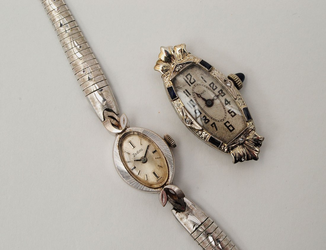 FOURTEEN KARAT WHITE GOLD LADIES WRISTWATCH: Swiss. By Zodiac. Together with a ladies watch marked Venus. (300/500)