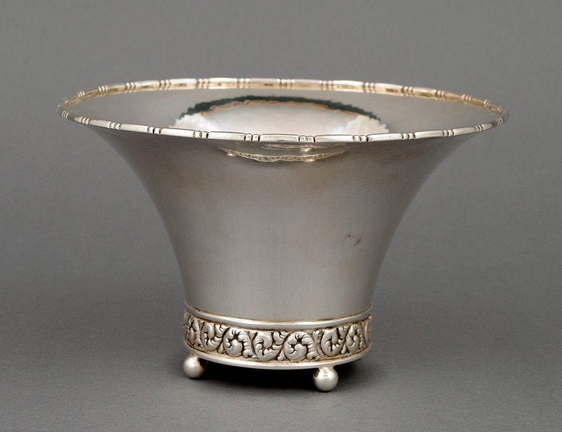 CONTINENTAL SILVER BOWL: Swedish. Date mark for 1928. Maker: C.G.H. Of conical shape, raised on four ball feet. Diameter 7 1/8". (9 oz) (200/300)