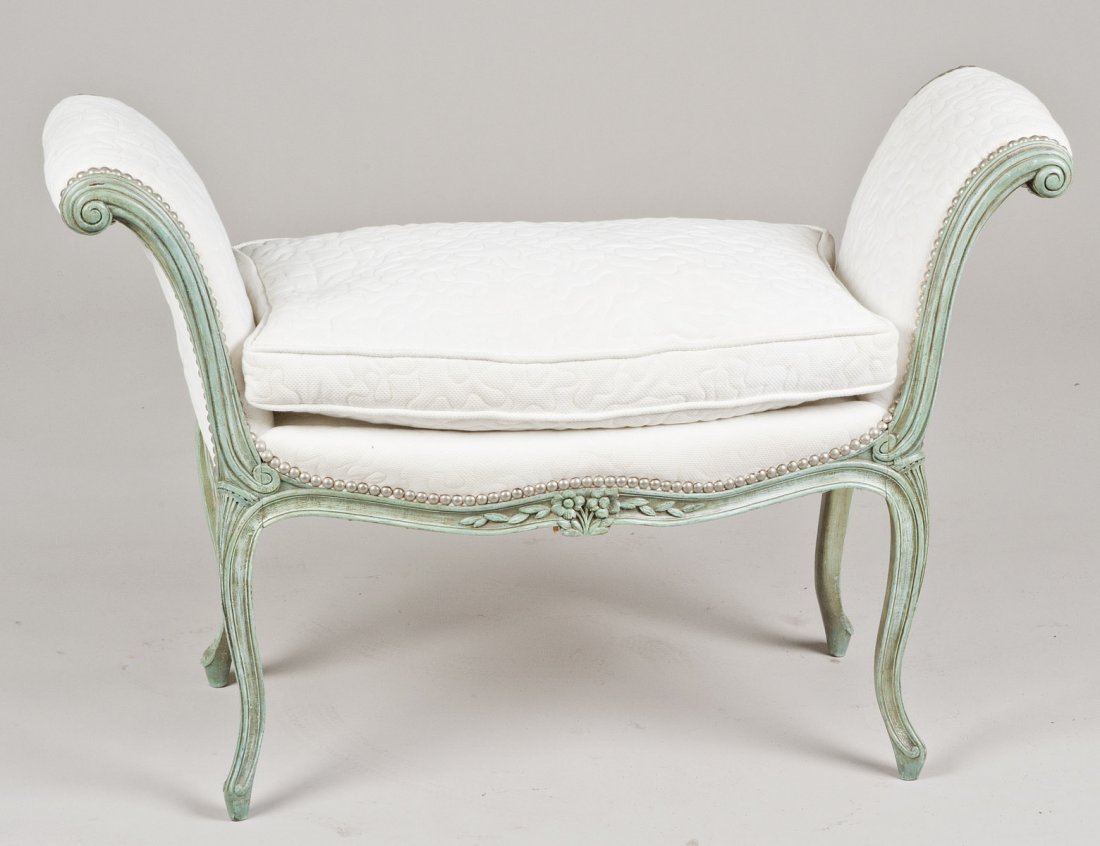 LOUIS XV STYLE PAINTED WINDOW BENCH: With curved flaring upright arms above the seat with a loose cushion, raised on cabriole legs. Height 27”. Width 40”. (150/200)