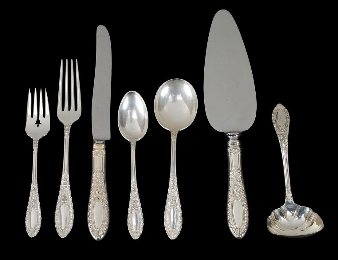 SIXTY-ONE PIECE STERLING SILVER PART FLATWARE SET: American. Circa 1940. Maker: Manchester Silver Co. In the "Gadroonette" pattern. Comprising: twelve dinner knives, eleven dinner forks, twelve salad forks, twelve soup spoons, twelve tea spoons, ladle