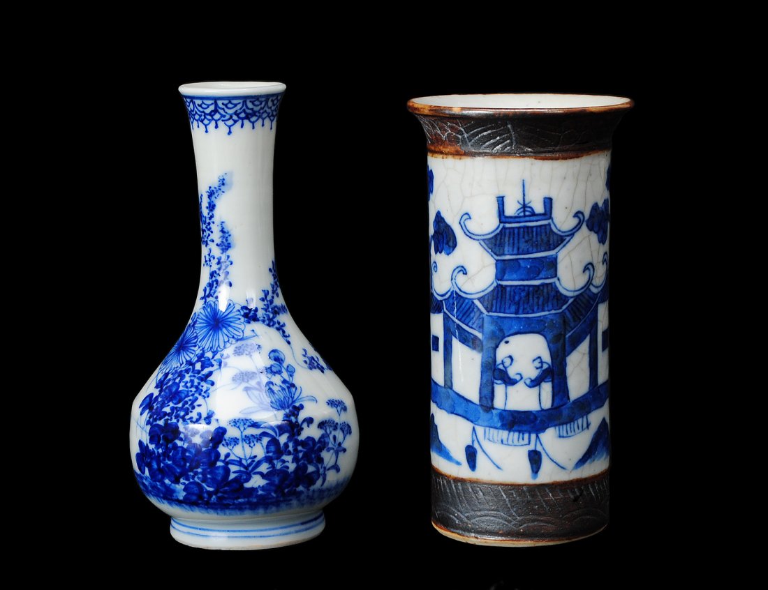 TWO BLUE AND WHITE PORCELAIN VASES: Chinese. Late 19th Century. The first of beaker form with canton pattern. Height 6". The second of bottle form decorated with blossoms. Height 6". (150/200)