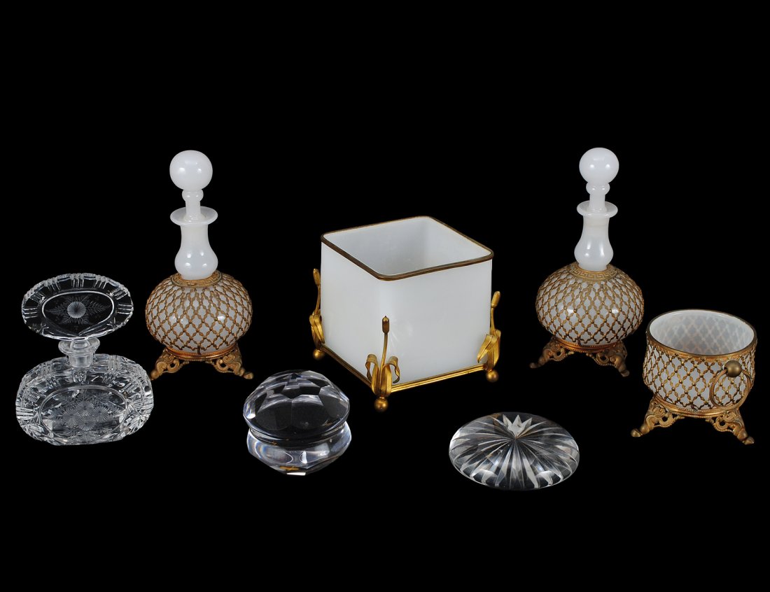 GROUP OF SEVEN GLASS ARTICLES: Comprising: brass mounted opaline jardiniere, cut glass scent bottle, two paperweights and a three piece brass enclosed vanity set. (Cond: damage to stoppers) (125/175)