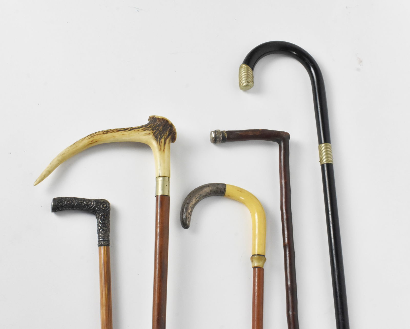 Group of Five Antique Canes/Walking Sticks made from wood, silver, horn, and nickel, (1 of 8)