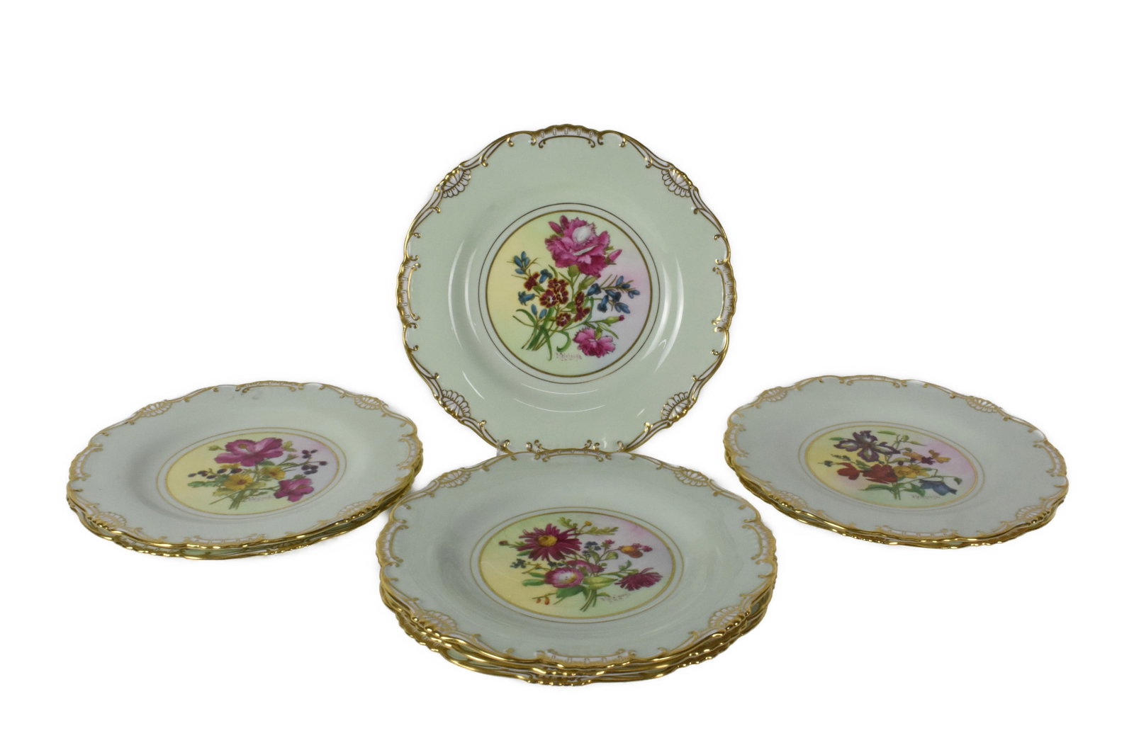 Set of Eight English Mintons Hand Painted Porcelain Dessert Plates, each with floral bouquets in the: Set of Eight English Mintons Hand Painted Porcelain Dessert Plates, each with floral bouquets in the central marked underside, in excellent condition with no scratches, no knife marks, no blemishes.