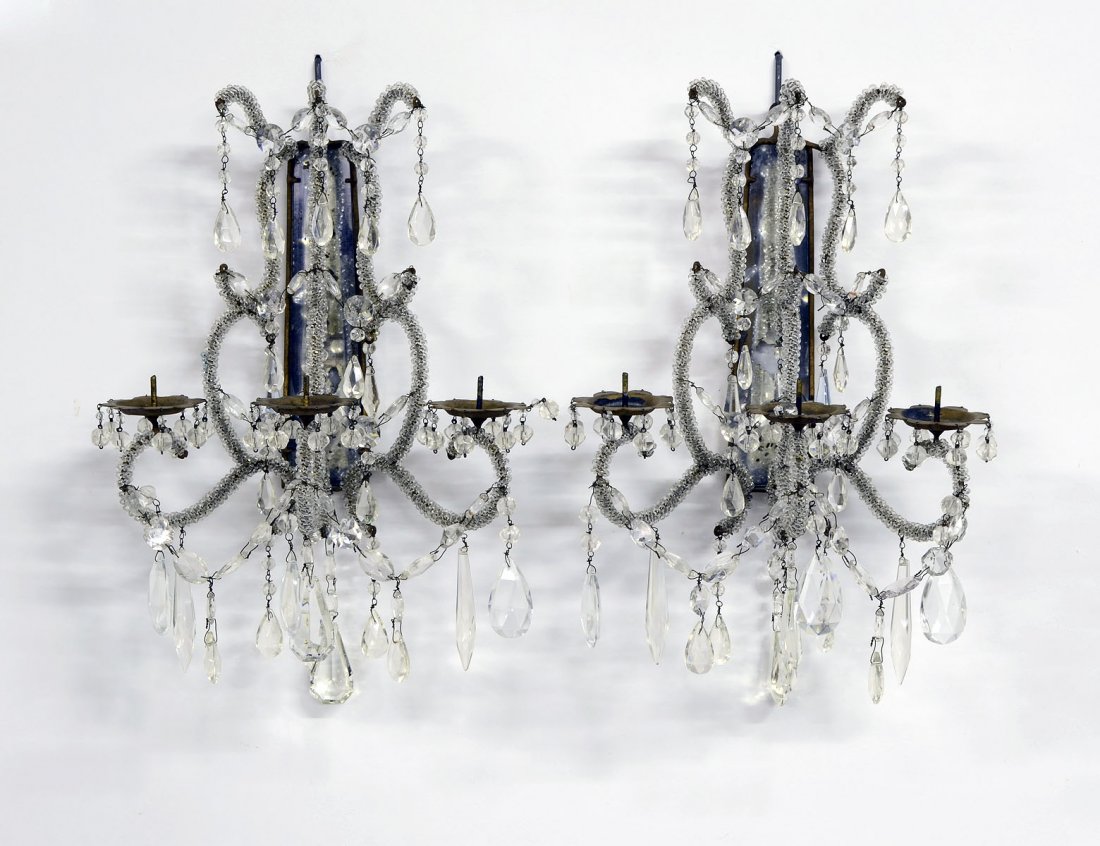 PAIR OF THREE LIGHT GLASS AND METAL SCONCES: Each with mirrored backplate supporting glass clad scroll candle arms. Height 13 1/2". (200/300)