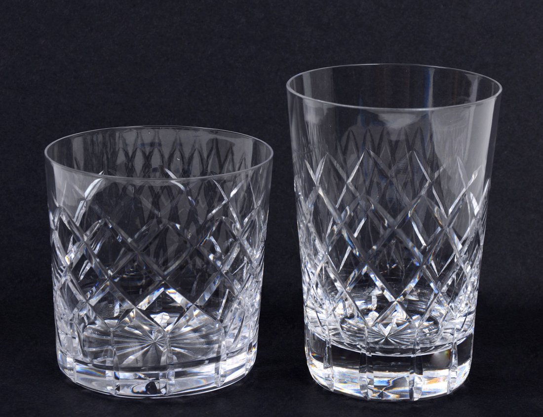 FOURTEEN PIECE TUDOR CUT CRYSTAL PART STEMWARE SET: English. Acid stamped. Comprising: eight water and six whiskey glasses. (75/125)