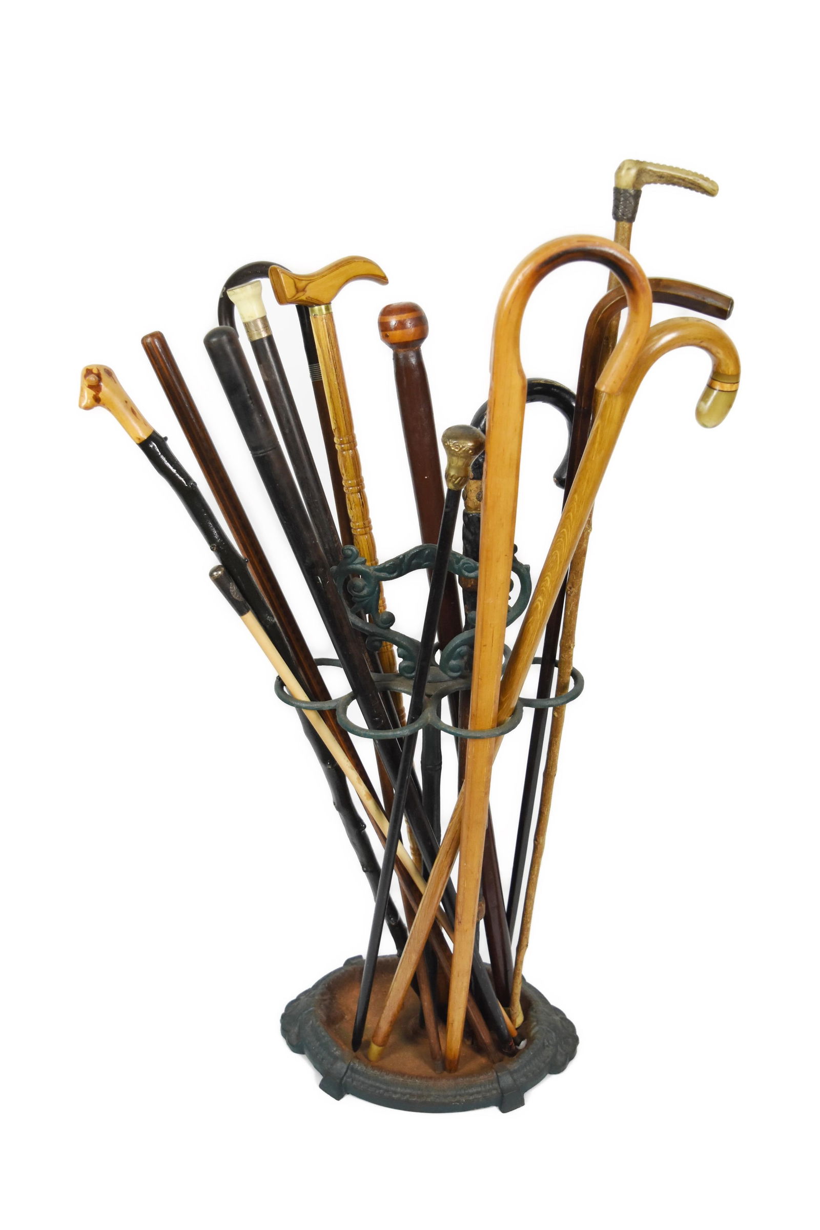 Group of Fourteen Assorted Wood Walking Canes/Sticks in a cast metal stand, 25 1/2" h. 12 1/2"w. (1 of 4)