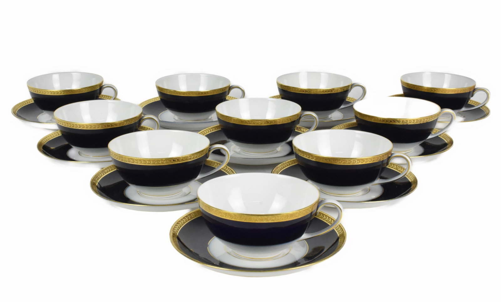 Set of Ten Bavarian Hutschenreuther Selb Cobalt and Gilded Cups and Saucers, with gold encrusted: Set of Ten Bavarian Hutschenreuther Selb Cobalt and Gilded Cups and Saucers, with gold encrusted rims, all marked underside with Spanish retailer mark, in excellent condition, no scratches, no blemish