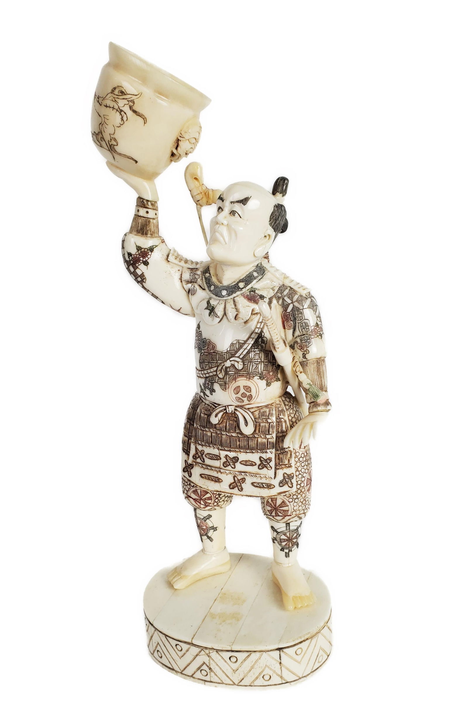 A Japanese Bone Standing Samurai with Quiver and Offering Vessel, polychromed, 10 13/4" h. 3 1/4" w.: A Japanese Bone Standing Samurai with Quiver and Offering Vessel, polychromed, 10 13/4" h. 3 1/4" w. 2 3/4" d.