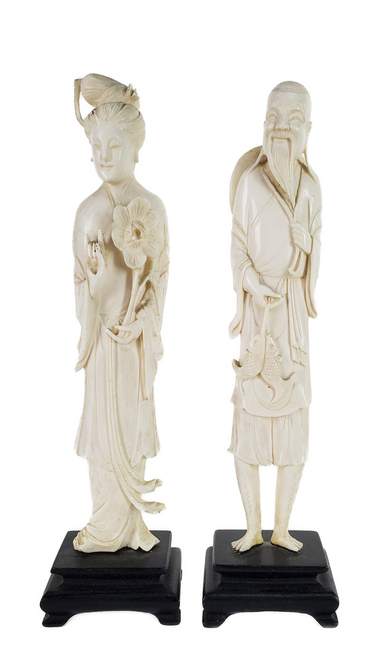 Pair of Chinese Carved Standing Figures, Quan-Yin and Fisherman, 8" h. 1 1/2" w. 3/4" d. Note: This: Pair of Chinese Carved Standing Figures, Quan-Yin and Fisherman, 8" h. 1 1/2" w. 3/4" d. Note: This lot can only be picked up at the gallery by the buyer or an agent assigned by the buyer. NO INTERNAT