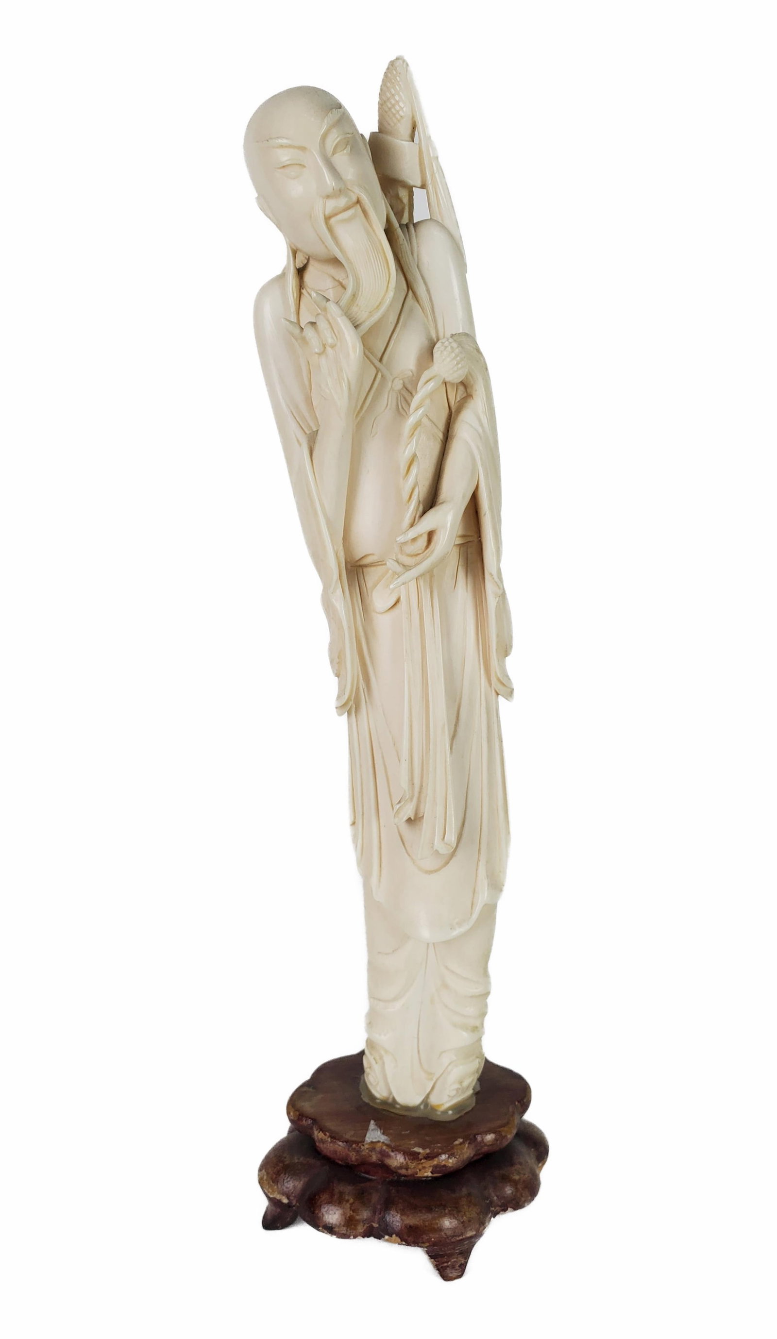 Chinese Carved Figure of a Lohan with Scepter, 9" h. 2 1/2" w. 1 1/2" d. Note: This lot can only be: Chinese Carved Figure of a Lohan with Scepter, 9" h. 2 1/2" w. 1 1/2" d. Note: This lot can only be picked up at the gallery by the buyer or an agent assigned by the buyer. NO INTERNATIONAL SHIPPING, 