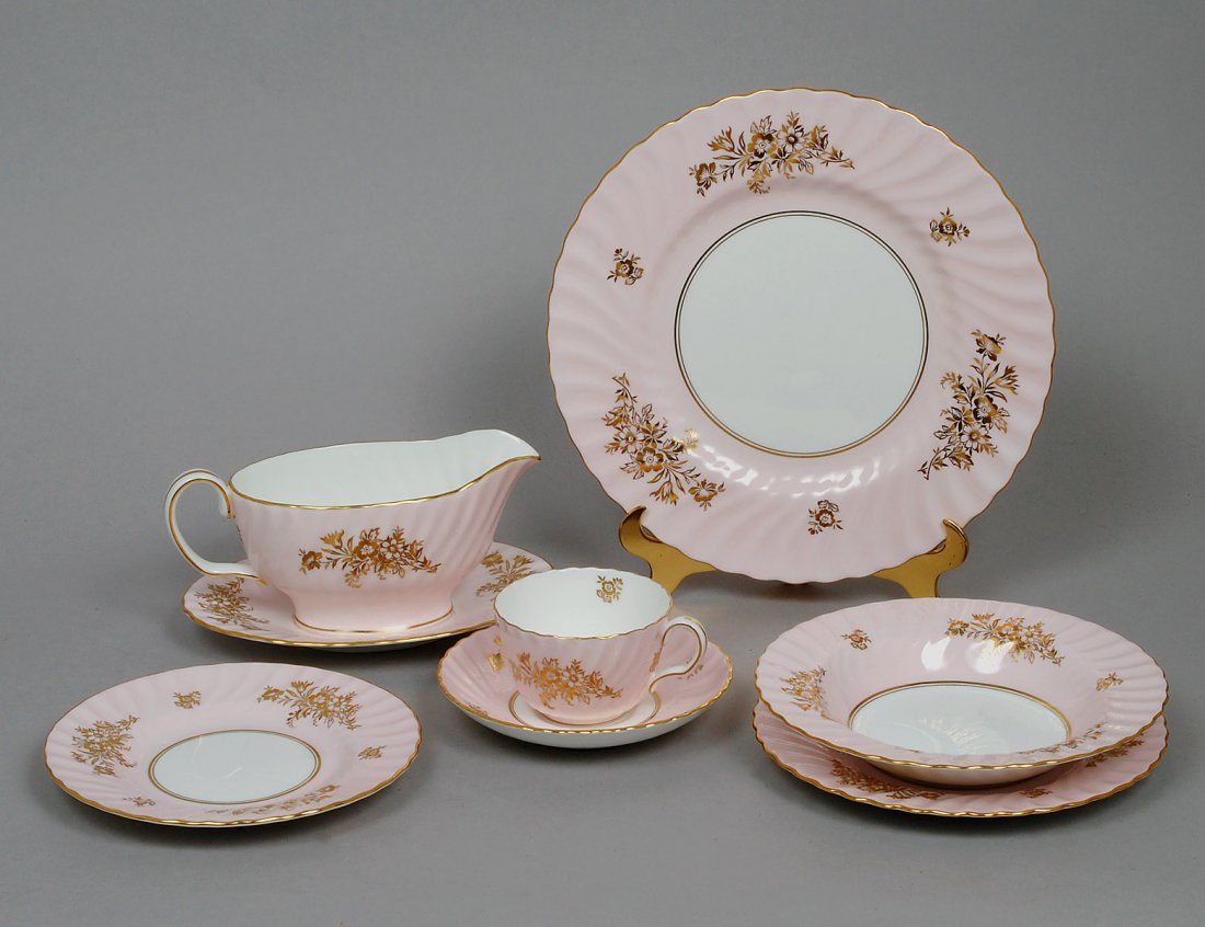 EIGHTY-ONE PIECE MINTON PORCELAIN DINNER SERVICE: English. 20th Century. In the “Minuet” pattern. Comprising: twelve dinner plates, twelve salad plates, twelve bread and butter plates, twelve soup plates, sixteen cups and saucers, and a sauce boa