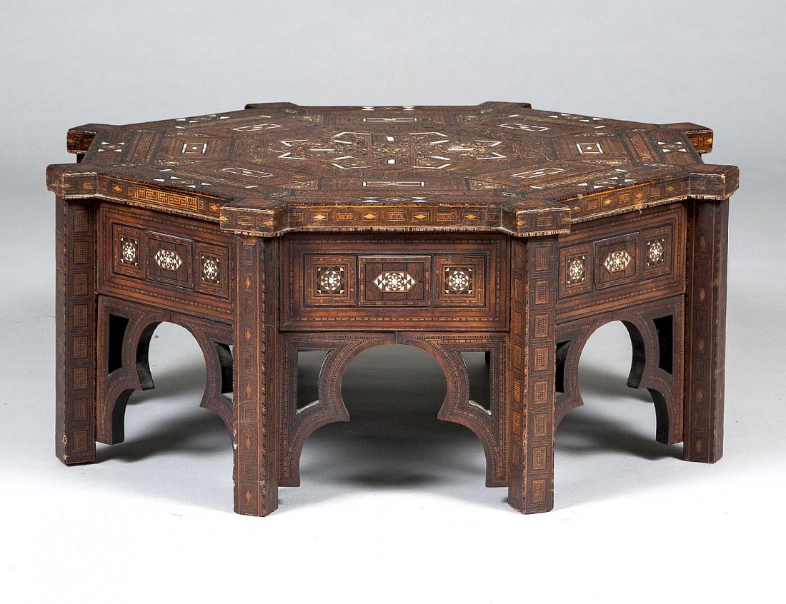 BONE AND WOOD INLAID LOW TABLE: Syrian. By Georges Bitar. Of octagonal form, raised on square legs. Height 12 1/4". Diameter 30 1/2". (250/350)