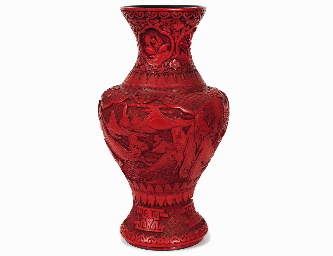 CINNABAR VASE: Chinese. 20th Century. Of baluster form carved with a continuous landscape scene. Height 14 1/4". (300/400)