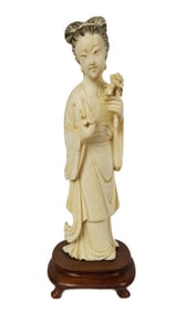 Chinese Carved Figure of Quan-Yin, 6 1/8" h. 1 1/2" w., on a wood stand.