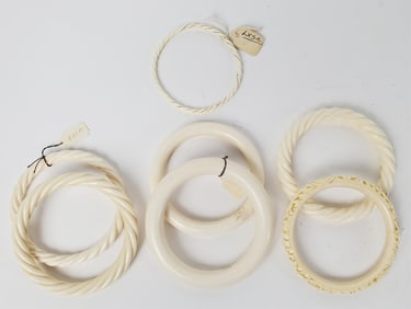 Group of Seven Carved Bangle Bracelets, Approx. opening- 2 3/8" dia.