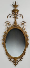 Antique Adams Style Giltwood Oval Mirror, 52 3/4" h. 22 1/2" w.