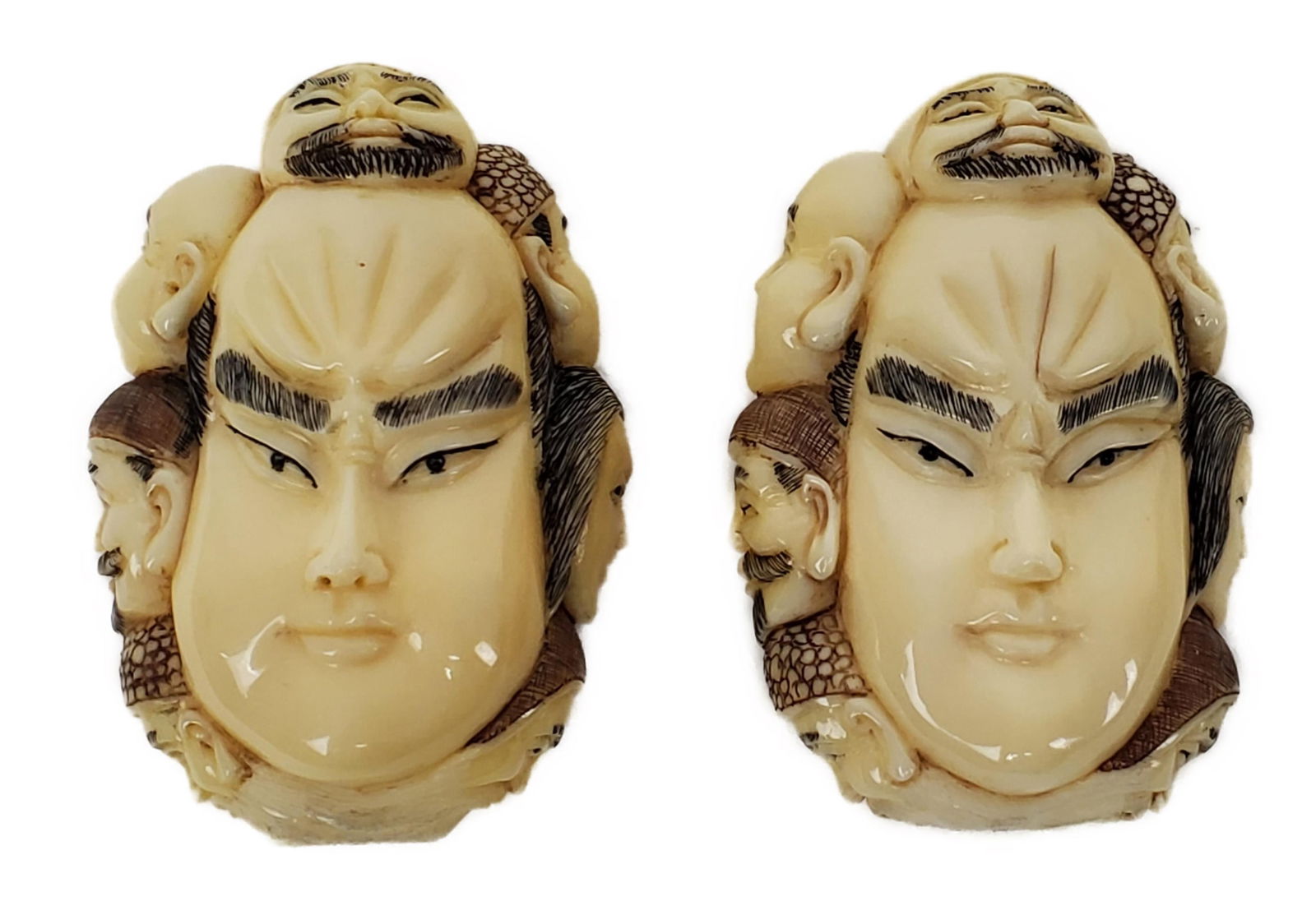 Two Japanese Bone Carvings of Kabuki Masks with head additional carvings, having chop marks, 2 1/8": Two Japanese Bone Carvings of Kabuki Masks with head additional carvings, having chop marks, 2 1/8" h. 1 3/8" w.