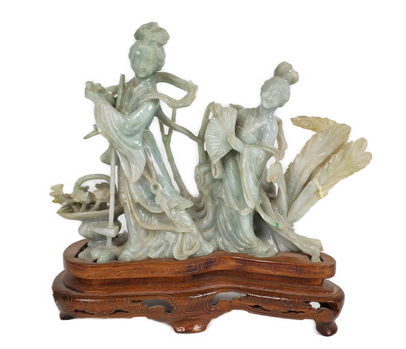 Chinese Green Jade Carving of Two Ladies with Foliage and a Basket of Blooming Flowers, 20th Century: Chinese Green Jade Carving of Two Ladies with Foliage and a Basket of Blooming Flowers, 20th Century, 6" h. 8 1/4" w. 2 1/2" d., on a wood conforming stand, repair of one leaf.