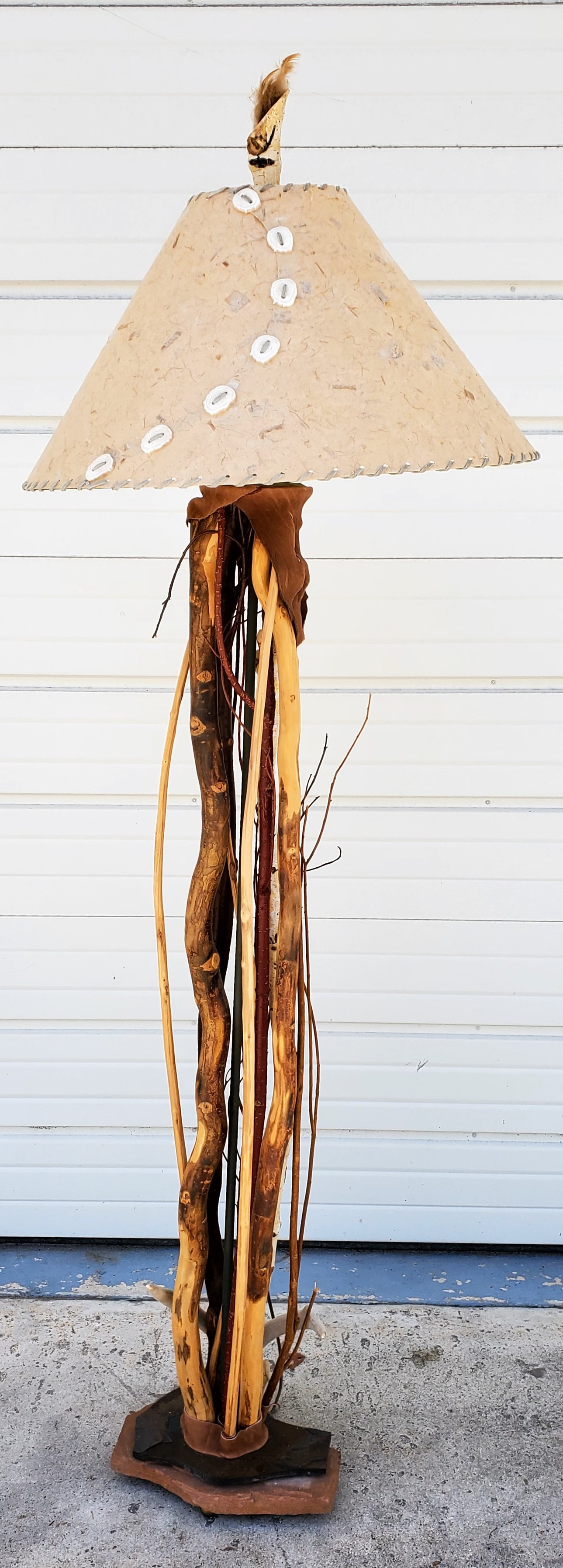 Southwest American Style Floor Lamp (Photo and Description to Come): Southwest American Style Floor Lamp, made with various wood sticks, vines, and suede, with handmade paper shade with bone sections, shade has some tears, 71" h. 12" w.