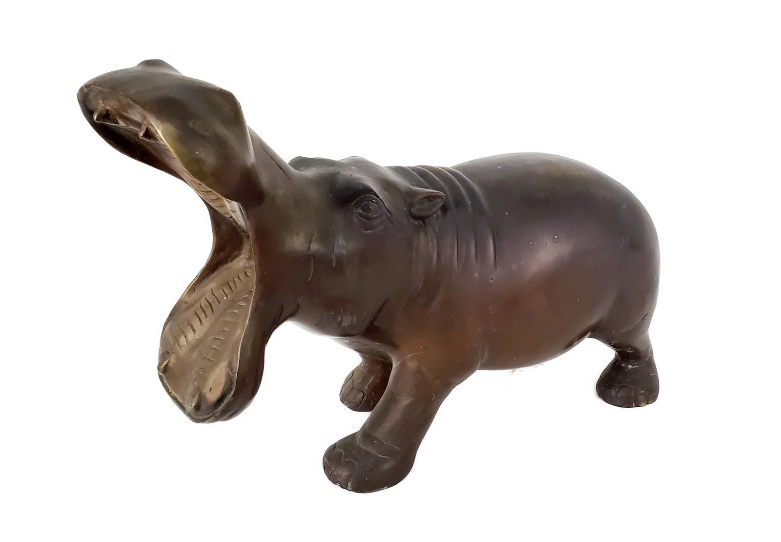 A Contemporary Bronze Sculpture of a Hippopotamus, 11 1/2" h. 16" L. 8" d., some light discoloration: A Contemporary Bronze Sculpture of a Hippopotamus, 11 1/2" h. 16" L. 8" d., some light discoloration to patina.