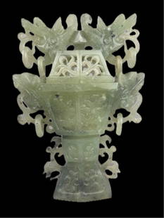 A Chinese Celedon Carved Jade Lidded Koro/Incense Burner, pierced with dragon ring handles, 9 1/2": A Chinese Celedon Carved Jade Lidded Koro/Incense Burner, pierced with dragon ring handles, 9 1/2" h. 6 1/2" w. 2" d.