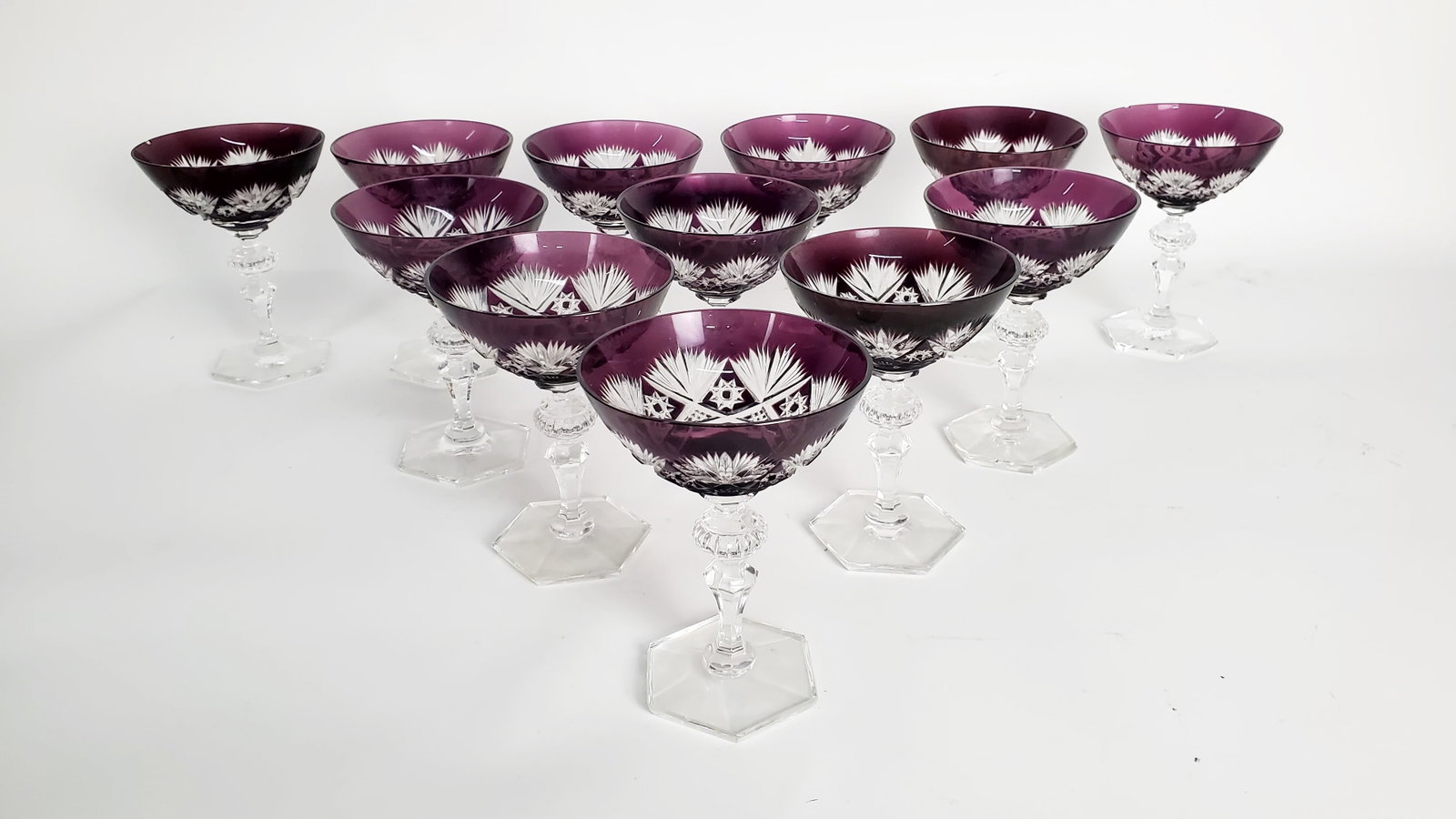 Set of 22 German Bohemian Style Amethyst Cut to Clear Wine Glasses,: Set of 22 German Bohemian Style Amethyst Cut to Clear Wine Glasses, 12-red wine glasses (three have rim chips) and 10-white wine glasses, has label attached to bottom of one white wine glass, in good 