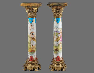 PAIR OF “SEVRES” PORCELAIN AND GILT BRONZE PEDESTALS: French. Late 19th Century. Each with square marble top above a gilt bronze capitol, the column painted by H. Fuchs, signed, supported by an elaborate gilt bronze base. Height 47”. (3000/4000)