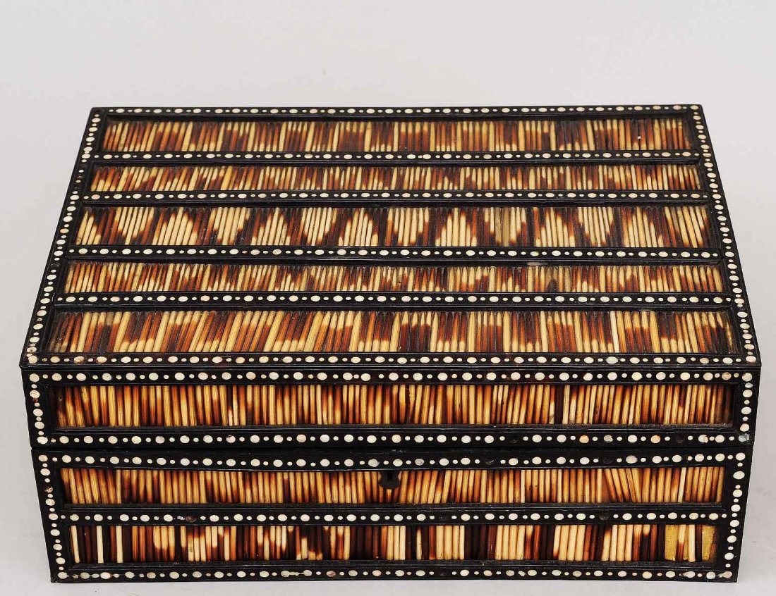 BONE INLAID EBONIZED WOOD AND QUILL WORK BOX: Anglo-Indian. 19th Century. The hinged lid opening to nine compartments with lids. Length 13 1/2". (800/1200)