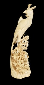 Chinese Carving of a Royal Bird, Early 20th Century, the long plumed bird resting on carving of